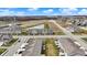 Scenic aerial view displays townhome community, pond, and distant water tower under a bright sky at 2792 Maricopa Blvd, Whitestown, IN 46075