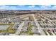 A serene aerial view of a new housing development featuring modern homes, tranquil ponds, and lush green spaces at 2792 Maricopa Blvd, Whitestown, IN 46075