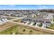 An aerial shot showcasing gray townhouses in a developed community with parking and green lawns at 2792 Maricopa Blvd, Whitestown, IN 46075
