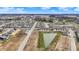 A delightful aerial perspective of a growing neighborhood featuring stylish homes, a lovely pond, and expansive open areas at 2792 Maricopa Blvd, Whitestown, IN 46075