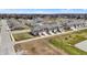 Aerial view of newly built townhomes in a residential area, featuring attached garages and well-kept green lawns at 2792 Maricopa Blvd, Whitestown, IN 46075