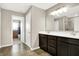 Bathroom boasts double sinks, wood flooring, and a neutral color scheme at 2792 Maricopa Blvd, Whitestown, IN 46075