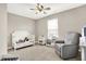 ' bedroom featuring a crib, a rocking chair, carpet flooring, and a ceiling fan at 2792 Maricopa Blvd, Whitestown, IN 46075