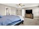 View of the bedroom shows a ceiling fan, a bed, and a dresser at 2792 Maricopa Blvd, Whitestown, IN 46075
