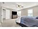 The bedroom is bathed in natural light and includes a ceiling fan and large windows at 2792 Maricopa Blvd, Whitestown, IN 46075