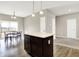Open-concept dining area near the kitchen features warm lighting and a view of the outside, ideal for Gathering meals at 2792 Maricopa Blvd, Whitestown, IN 46075