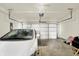Garage featuring a white car, a white garage door, concrete flooring, and garage door openers at 2792 Maricopa Blvd, Whitestown, IN 46075