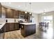 Well-appointed kitchen featuring an island, stainless steel appliances, and an adjacent dining area with natural light at 2792 Maricopa Blvd, Whitestown, IN 46075