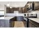 A beautifully designed kitchen with a subway tile backsplash, gas range, and a convenient center island at 2792 Maricopa Blvd, Whitestown, IN 46075