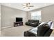 Comfortable living room with neutral walls, ceiling fan, carpeted floors, and ample seating at 2792 Maricopa Blvd, Whitestown, IN 46075