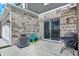 Enclosed patio area featuring neutral brick walls, a sliding glass door and concrete floors at 2792 Maricopa Blvd, Whitestown, IN 46075