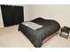 Bedroom with carpet, black duvet cover, side table, and black curtains at 2976 W Tapestry Dr, Monrovia, IN 46157