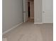 Bright bedroom featuring an open doorway, two white doors, and neutral carpet at 2976 W Tapestry Dr, Monrovia, IN 46157