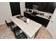 Features a kitchen island with barstool seating and dark cabinets at 2976 W Tapestry Dr, Monrovia, IN 46157
