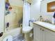 Cozy bathroom showcasing a tub with shower, standard toilet, and modern vanity with ample lighting at 3016 Sheridan St, Anderson, IN 46016