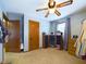 Well-lit bedroom with a ceiling fan and spacious closet, offering a blend of comfort and convenience at 3016 Sheridan St, Anderson, IN 46016