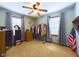 Bright bedroom with natural light, a ceiling fan, and ample space for storage and organization at 3016 Sheridan St, Anderson, IN 46016