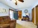 Relaxing living room area with a television and view into the adjacent kitchen at 3016 Sheridan St, Anderson, IN 46016