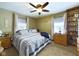 Comfortable main bedroom with a cozy quilt, ample natural light, and plenty of storage space at 3016 Sheridan St, Anderson, IN 46016