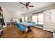 Bright dining room with a blue tablecloth-covered table, laminate floors, and a view to the entryway at 307 Blue Spruce Dr, Pendleton, IN 46064
