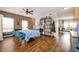 Cozy dining room with blue chairs, wood floors, ceiling fan, and lots of natural light at 307 Blue Spruce Dr, Pendleton, IN 46064