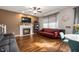 Cozy living room with a fireplace, hardwood floors, and stylish decor creating a warm atmosphere at 307 Blue Spruce Dr, Pendleton, IN 46064