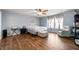Relaxing main bedroom featuring plush chair and neutral color palette at 307 Blue Spruce Dr, Pendleton, IN 46064
