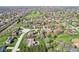 An aerial perspective of the neighborhood with its mix of well-kept homes and verdant landscapes at 3376 Scramble Dr, Greenwood, IN 46143