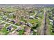 This aerial view displays the well-spaced homes and green landscaping of a suburban community on a bright, sunny day at 3376 Scramble Dr, Greenwood, IN 46143