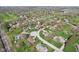 An aerial view capturing the homes, landscaping and quiet neighborhood street at 3376 Scramble Dr, Greenwood, IN 46143