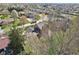 An aerial view showcasing the home's roof and surrounding mature trees in a tranquil residential area at 3376 Scramble Dr, Greenwood, IN 46143