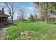 Large backyard with mature trees and green grass at 3376 Scramble Dr, Greenwood, IN 46143