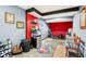 Basement featuring red and blue walls and including small refrigerator and a Philadelphia Phillies rug at 3376 Scramble Dr, Greenwood, IN 46143