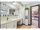 Elegant bathroom featuring a vanity, mirror, stylish lighting, and access to a closet at 3376 Scramble Dr, Greenwood, IN 46143