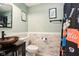Bathroom with a modern bowl sink, patterned shower curtain, and wood paneled accent wall at 3376 Scramble Dr, Greenwood, IN 46143