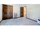 A basic bedroom with dark wood trim, carpet floors, and a double door closet at 3376 Scramble Dr, Greenwood, IN 46143