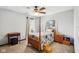 Inviting bedroom with a four-poster bed, floral bedspread and carpet flooring at 3376 Scramble Dr, Greenwood, IN 46143