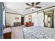 Spacious bedroom boasts a ceiling fan, wood trim, and a unique sliding barn door at 3376 Scramble Dr, Greenwood, IN 46143