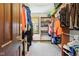 Walk-in closet with shelving and rods for optimal storage and organization, illuminated by a window at 3376 Scramble Dr, Greenwood, IN 46143