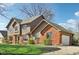 Beautiful two-story home featuring wood and brick exterior with a two car attached garage at 3376 Scramble Dr, Greenwood, IN 46143