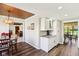 This kitchen features a breakfast bar, granite countertops, white cabinets, and stainless steel appliances at 3376 Scramble Dr, Greenwood, IN 46143
