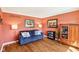 Cozy living room with a comfortable blue sofa, decorative pillows, and stylish decor at 3376 Scramble Dr, Greenwood, IN 46143