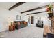 Comfortable living room featuring a brick fireplace, beamed ceilings, and plush seating at 3376 Scramble Dr, Greenwood, IN 46143