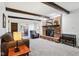 Cozy living room showcasing a brick fireplace, wood beams, and an open floor plan at 3376 Scramble Dr, Greenwood, IN 46143