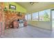 Covered patio with brick oven and grill with views of the backyard at 3376 Scramble Dr, Greenwood, IN 46143