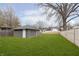 Large backyard with a detached garage, offering ample space for outdoor activities at 4317 N Park Ave, Indianapolis, IN 46205