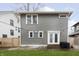 Charming home with a well-manicured backyard, a patio, and stylish string lights at 4317 N Park Ave, Indianapolis, IN 46205