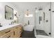 Modern bathroom with a soaking tub, glass-enclosed shower, updated vanity, and stylish fixtures at 4317 N Park Ave, Indianapolis, IN 46205