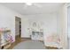 Bright bedroom with wooden floors, featuring a cozy reading nook and playful decor at 4317 N Park Ave, Indianapolis, IN 46205