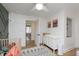 Bright Bedroom with hardwood floors, modern decor, and a changing table at 4317 N Park Ave, Indianapolis, IN 46205